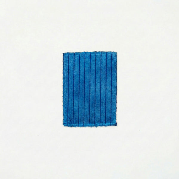 Slushie Blue TEDDY fabric swatch. Shows the textured wide-wale corduroy material used for modular sofa covers